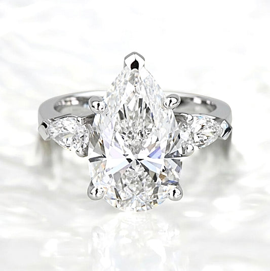 5.5 Carats Pear Diamond Ring With Pear Side Stones, 950 Platinum