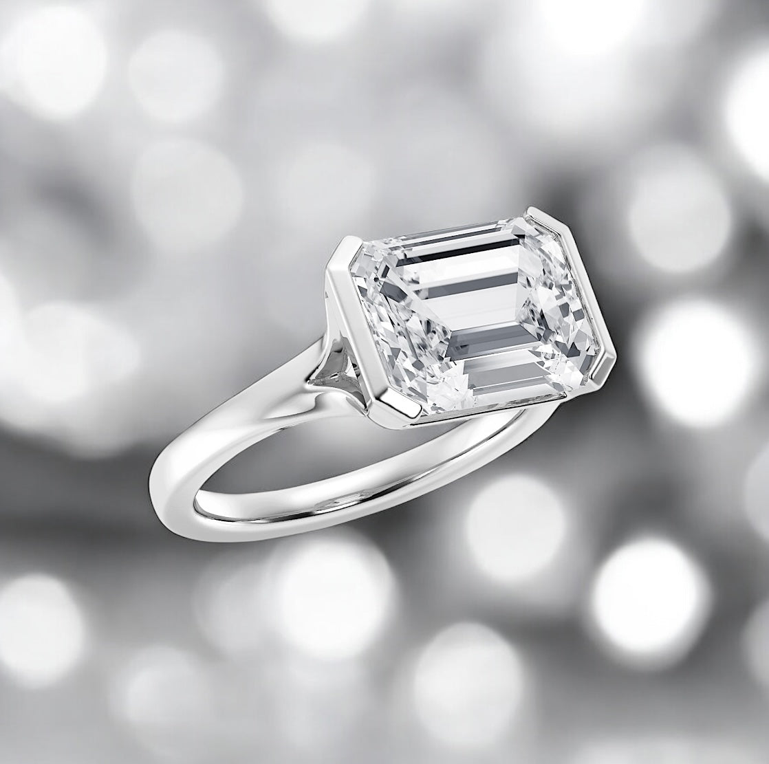 5.68 Carat Emerald Cut Diamond Half Bezel Solitaire Ring set in 950 Platinum